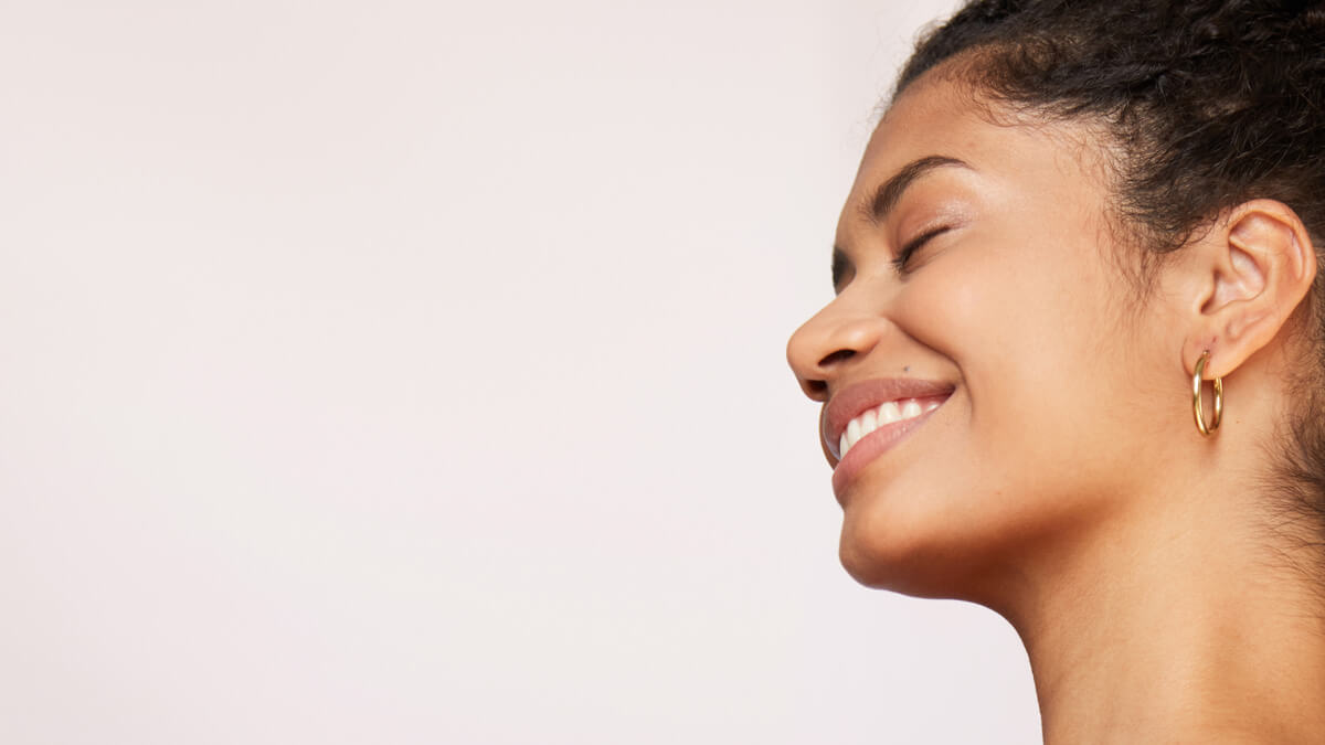 Woman closing her eyes with smooth skin